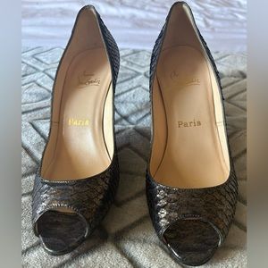 Christian Louboutin Python Peep Toe Pumps. Heel cap missing for one of the heels